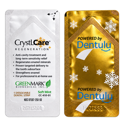 Two dental treatment single-use packets shown side by side on a plain white background. The left packet is white with black and green text reading 'CrystCare Regeneration' and 'GreenMark Biomedical Inc.